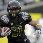 
              FILE - Oregon running back LaMichael James (21) carries the ball during the third quarter of an NCAA college football game against Washington, Saturday, Nov. 6, 2010, in Eugene, Ore. LaMichael James was elected to the College Football Hall of Fame on Monday, Jan. 9, 2023. (AP Photo/Rick Bowmer, File)
            