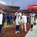 Seattle Seahawks quarterback Geno Smith (7) and wide receiver DK Metcalf (14) walk off the field after an NFL wild card playoff football game against the San Francisco 49ers in Santa Clara, Calif., Saturday, Jan. 14, 2023. The 49ers won 41-23. (AP Photo/Godofredo A. Vásquez)