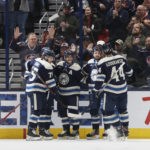 Columbus Blue Jackets players celebrate their goal against the Washington Capitals during the first period of an NHL hockey game on Thursday, Jan. 5, 2023, in Columbus, Ohio. (AP Photo/Jay LaPrete)