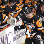 
              Pittsburgh Penguins' Evgeni Malkin returns to the bench after scoring during the first period of an NHL hockey game against the San Jose Sharks in Pittsburgh, Saturday, Jan. 28, 2023. (AP Photo/Gene J. Puskar)
            