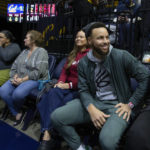 
              Golden State Warriors star Stephen Curry, right, and his mother Sonya Curry take in the action during the first half of an NCAA college basketball game between Stanford and California, Sunday, Jan. 8, 2023, in Berkeley, Calif. (AP Photo/D. Ross Cameron)
            