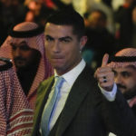 
              Cristiano Ronaldoreacts during his official unveiling as a new member of Al Nassr soccer club in in Riyadh, Saudi Arabia, Tuesday, Jan. 3, 2023.Ronaldo, who has won five Ballon d'Ors awards for the best soccer player in the world and five Champions League titles, will play outside of Europe for the first time in his storied career. (AP Photo/Amr Nabil)
            