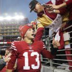 San Francisco 49ers quarterback Brock Purdy (13) speaks to supporters after an NFL wild card playoff football game against the Seattle Seahawks in Santa Clara, Calif., Saturday, Jan. 14, 2023. The 49ers won 41-23. (AP Photo/Godofredo A. Vásquez)