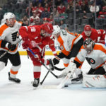 Philadelphia Flyers goaltender Carter Hart (79) stops a Detroit Red Wings center Andrew Copp (18) shot in the third period of an NHL hockey game Saturday, Jan. 21, 2023, in Detroit. (AP Photo/Paul Sancya)