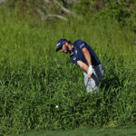 
              Max Homa hits out of the rough along the 14th green during the first round of the Tournament of Champions golf event, Thursday, Jan. 5, 2023, at Kapalua Plantation Course in Kapalua, Hawaii. (AP Photo/Matt York)
            