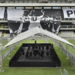
              Workers prepare the staging area for the funeral of the late Brazilian soccer legend Pele on center field of the Vila Belmiro stadium, home of the Santos soccer club, in Santos, Brazil, Saturday, Dec. 31, 2022.  Pele, who played most of his career with Santos, died in Sao Paulo on Thursday at the age of 82. (AP Photo/Matias Delacroix)
            