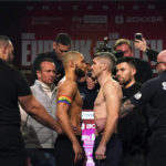 
              Britain's Chris Eubank Jr, centre left and Liam Smith look on, during the weigh-in ahead of their middleweight bout on Saturday, at the Manchester Central Convention Complex, Manchester, England, Friday, Jan. 20, 2023. (Nick Potts/PA via AP)
            
