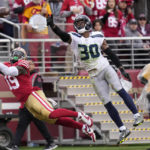 San Francisco 49ers wide receiver Deebo Samuel (19) cannot catch a pass while being defended by Seattle Seahawks cornerback Mike Jackson (30) during the first half of an NFL wild card playoff football game in Santa Clara, Calif., Saturday, Jan. 14, 2023. (AP Photo/Godofredo A. Vásquez)