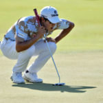 
              S.H. Kim lines up his putt on the first green during the third round of the Sony Open golf tournament, Saturday, Jan. 14, 2023, at Waialae Country Club in Honolulu. (AP Photo/Matt York)
            