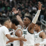 Michigan State guard Tyson Walker, right, reacts after a basket during the first half of an NCAA college basketball game against Purdue, Monday, Jan. 16, 2023, in East Lansing, Mich. (AP Photo/Carlos Osorio)