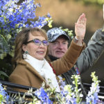 
              Tournament of Roses Grand Marshal Gabby Giffords waves to the crowd at the 134th Rose Parade in Pasadena, Calif., Monday, Jan. 2, 2023. (AP Photo/Michael Owen Baker)
            