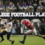 TCU quarterback Max Duggan (15) runs out of the pocket against Georgia linebacker Robert Beal Jr. (33) during the second half of the national championship NCAA College Football Playoff game, Monday, Jan. 9, 2023, in Inglewood, Calif. (AP Photo/Mark J. Terrill)
