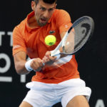 
              Serbia's Novak Djokovic makes a backhand return to France's Constant Lestienne during their Round of 32 match at the Adelaide International Tennis tournament in Adelaide, Australia, Tuesday, Jan. 3, 2023. (AP Photo/Kelly Barnes)
            