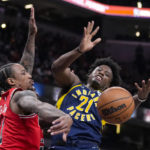 
              Chicago Bulls forward DeMar DeRozan (11) knocks the ball away from Indiana Pacers forward Terry Taylor (21) during the first half of an NBA basketball game in Indianapolis, Tuesday, Jan. 24, 2023. (AP Photo/Michael Conroy)
            