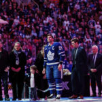 
              Toronto Maple Leafs center John Tavares stands alongside his kids and wife during a pregame ceremony for reaching 1,000 career games, before an NHL hockey game against the Washington Capitals in Toronto on Sunday, Jan. 29, 2023. (Cole Burston/The Canadian Press via AP)
            