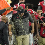 Georgia head coach Kirby Smart is doused during the second half of the national championship NCAA College Football Playoff game against TCU, Monday, Jan. 9, 2023, in Inglewood, Calif. Georgia won 65-7. (AP Photo/Marcio Jose Sanchez)