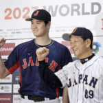 
              Shohei Ohtani, left, of Los Angeles Angels, and Japan's manager Hideki Kuriyama, right, pose together during a press conference in Tokyo, Japan, Friday, Jan. 6, 2023. Japan officials on Friday named 12 members of the World Baseball Classic team that will represent the country. The World Baseball Classic will be played March 8-21.(Iori Sagisawa/Kyodo News via AP)
            