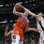 
              Chicago Bulls center Nikola Vucevic, right, defends against Oklahoma City Thunder center Mike Muscala (33) during the first half of an NBA basketball game Friday, Jan. 13, 2023, in Chicago. (AP Photo/Matt Marton)
            