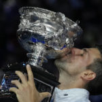 
              Novak Djokovic of Serbia kisses the Norman Brookes Challenge Cup after defeating Stefanos Tsitsipas of Greece in the men's singles final at the Australian Open tennis championship in Melbourne, Australia, Sunday, Jan. 29, 2023. (AP Photo/Aaron Favila)
            