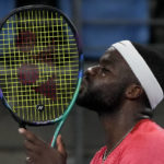 United States' Frances Tiafoe kisses his racket after winning the second set against Britain's Daniel Evans during their match at the United Cup tennis event in Sydney, Australia, Wednesday, Jan. 4, 2023. (AP Photo/Mark Baker)
