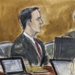 
              In this courtroom sketch, former Fox executive Hernandez Lopez, center, sits with his defense attorneys in Brooklyn federal court Tuesday, Jan. 17, 2023, in New York. Two former Fox sports executives, Carlos Martinez and Lopez, and a sports marketing company based in Argentina are going on trial in a scheme to pay bribes to secure broadcasting rights to South America's premier club soccer tournament and to the World Cup. (Elizabeth Williams via AP)
            