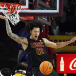 Southern California guard Tre White (22) celebrates his dunk against Arizona State during the second half of an NCAA college basketball game in Tempe, Ariz., Saturday, Jan. 21, 2023. (AP Photo/Ross D. Franklin)