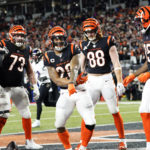Cincinnati Bengals running back Joe Mixon (28) celebrates with teammates after a Bengals score in the first half of an NFL wild-card playoff football game against the Baltimore Ravens in Cincinnati, Sunday, Jan. 15, 2023. (AP Photo/Joshua A. Bickel)
