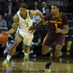 Oregon guard Keeshawn Barthelemy (3) fouls Arizona State guard Luther Muhammad (1) as he brings the ball upcourt during the first half of an NCAA college basketball game Thursday, Jan. 12, 2023, in Eugene, Ore. (AP Photo/Andy Nelson)