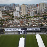 
              Giant banners that read in Portuguese: "Long live King Pele, 82 years", are displayed in the stands of the Vila Belmiro stadium, home of the Santos soccer club, where Pele's funeral will take place, in Santos, Brazil, Saturday, Dec. 31, 2022.  Pele, who played most of his career with Santos, died in Sao Paulo on Thursday at the age of 82. (AP Photo/Matias Delacroix)
            