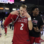 
              Loyola Marymount guard Justin Ahrens (2) celebrates the team's 68-67 win against Gonzaga after an NCAA college basketball game, Thursday, Jan. 19, 2023, in Spokane, Wash. (AP Photo/Young Kwak)
            