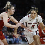 
              South Carolina forward Victaria Saxton (5) drives against Arkansas guard Saylor Poffenbarger during the first half of an NCAA college basketball game in Columbia, S.C., Sunday, Jan. 22, 2023. (AP Photo/Nell Redmond)
            