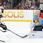 Boston Bruins left wing Taylor Hall, left, attempts a shot at Florida Panthers goaltender Alex Lyon (34) during the first period of an NHL hockey game, Saturday, Jan. 28, 2023, in Sunrise, Fla. (AP Photo/Wilfredo Lee)