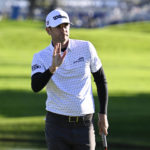 
              Sam Ryder acknowledges the gallery after finishing his round on the 18th hole of the South Course at Torrey Pines during the second round of the Farmers Insurance Open golf tournament, Thursday, Jan. 26, 2023, in San Diego. (AP Photo/Denis Poroy)
            
