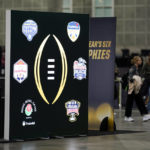 
              CFP and bowl logos are flashed on a screen at a fan fest at the Los Angeles Convention Center, Thursday, Jan. 5, 2023, in Los Angeles. Georgia is scheduled to face TCU, Monday for the CFP national football championship in Inglewood, Calif. (AP Photo/Marcio Jose Sanchez)
            