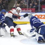 Toronto Maple Leafs goaltender Matt Murray (30) makes a save on Florida Panthers forward Aleksander Barkov (16) as Maple Leafs forward William Nylander (88) defends during the first period of an NHL hockey game Tuesday, Jan. 17, 2023, in Toronto. (Nathan Denette/The Canadian Press via AP)
