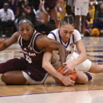 
              Texas A&M Kay Kay Green, left, and LSU guard Last-Tear Poa (13) vie for the ball during an NCAA college basketball game Thursday, Jan. 5, 2023, in Baton Rouge, La. (Hilary Scheinuk/The Advocate via AP)
            