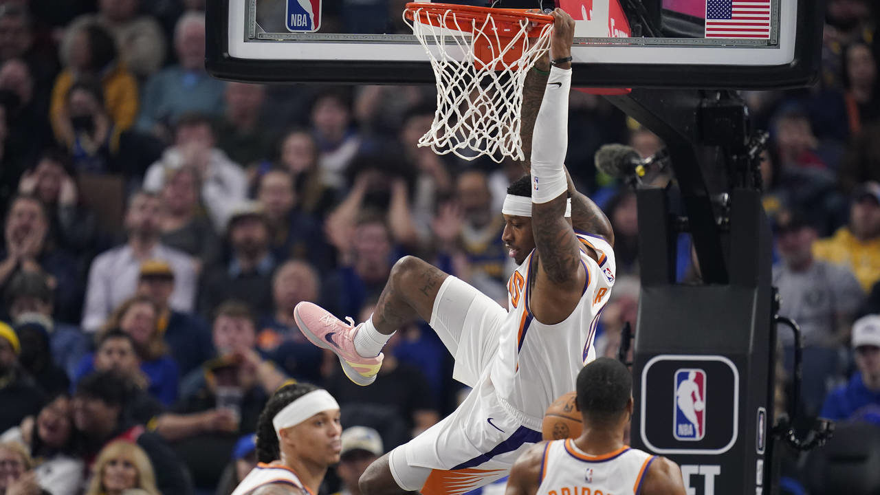 Phoenix Suns forward Torrey Craig dunks against the Golden State Warriors during the first half of ...