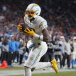 Los Angeles Chargers wide receiver Keenan Allen (13) catches a pass for a touchdown against the Denver Broncos during the second half of an NFL football game in Denver, Sunday, Jan. 8, 2023. (AP Photo/David Zalubowski)