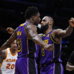 Los Angeles Lakers' Thomas Bryant (31) and LeBron James (6) celebrate after Bryant scored a basket and drew a foul during the first half of the team's NBA basketball game against the Atlanta Hawks on Friday, Jan. 6, 2023, in Los Angeles. (AP Photo/Jae C. Hong)