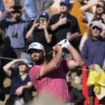 Jon Rahm hits from the ninth tee during the final round of the American Express golf tournament on the Pete Dye Stadium Course at PGA West Sunday, Jan. 22, 2023, in La Quinta, Calif. (AP Photo/Mark J. Terrill)