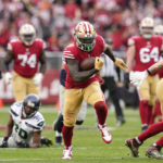 San Francisco 49ers wide receiver Deebo Samuel (19) runs against the Seattle Seahawks during the second half of an NFL wild card playoff football game in Santa Clara, Calif., Saturday, Jan. 14, 2023. (AP Photo/Godofredo A. Vásquez)