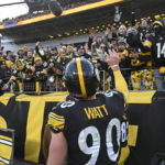 
              Pittsburgh Steelers linebacker T.J. Watt (90) tosses a glove to fans as he heads to the locker room following an NFL football game against the Cleveland Browns in Pittsburgh, Sunday, Jan. 8, 2023. (AP Photo/Don Wright)
            