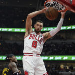 
              Chicago Bulls guard Zach LaVine (8) dunks the ball against the Utah Jazz during the first quarter of a NBA basketball game Saturday, Jan. 7, 2023, in Chicago. (AP Photo/David Banks)
            