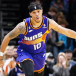 Phoenix Suns' Damion Lee (10) celebrates after a 3-point basket during the first half of an NBA basketball game against the Indiana Pacers in Phoenix, Saturday, Jan. 21, 2023. (AP Photo/Darryl Webb)