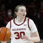 FILE -Oklahoma guard Taylor Robertson (30) moves the ball during the second half of an NCAA college basketball game against Baylor Wednesday, Jan. 12, 2022, in Norman, Okla. Taylor Robertson became the Division I leader in 3-pointers, Saturday, Jan. 28, 2023. (AP Photo/Garett Fisbeck, File)