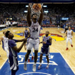 
              Kansas forward K.J. Adams Jr. (24) dunks the ball during the first half of an NCAA college basketball game against Kansas State Tuesday, Jan. 31, 2023, in Lawrence, Kan. (AP Photo/Charlie Riedel)
            