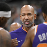Phoenix Suns head coach Monty Williams, center, talks to his players during the second half of an NBA basketball game against the San Antonio Spurs, Saturday, Jan. 28, 2023, in San Antonio. (AP Photo/Darren Abate)