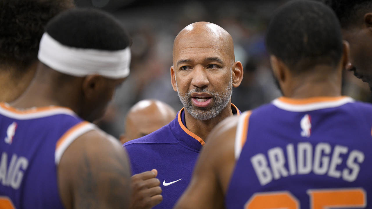 Phoenix Suns head coach Monty Williams, center, talks to his players during the second half of an N...