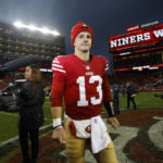 San Francisco 49ers quarterback Brock Purdy (13) walks on the field after an NFL wild card playoff football game against the Seattle Seahawks in Santa Clara, Calif., Saturday, Jan. 14, 2023. The 49ers won 41-23. (AP Photo/Josie Lepe)
