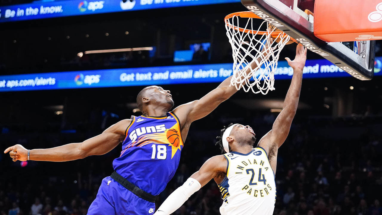 Phoenix Suns' Bismack Biyombo (18) blocks a shot by Indiana Pacers' Buddy Field (24) during the fir...
